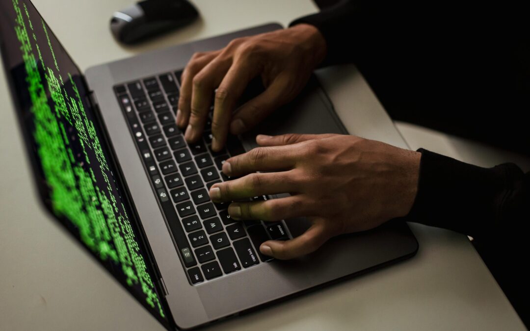 crop-cyber-spy-hacking-system-while-typing-on-laptop